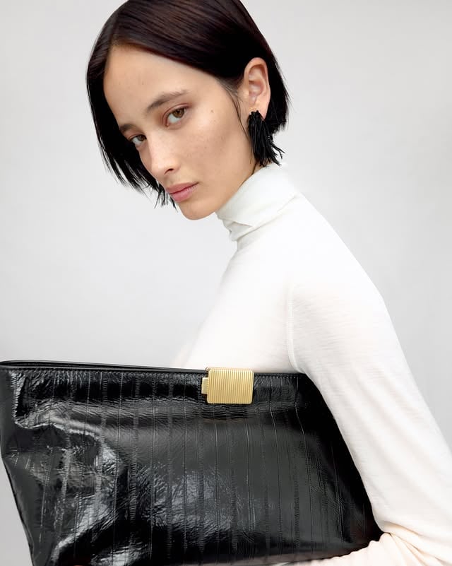 Friesian Feather Earrings. Sculptural soft‑spike hoops finished with layers of ostrich feather.Available at camillaandmarc.com and in boutiques. by @camillaandmarc