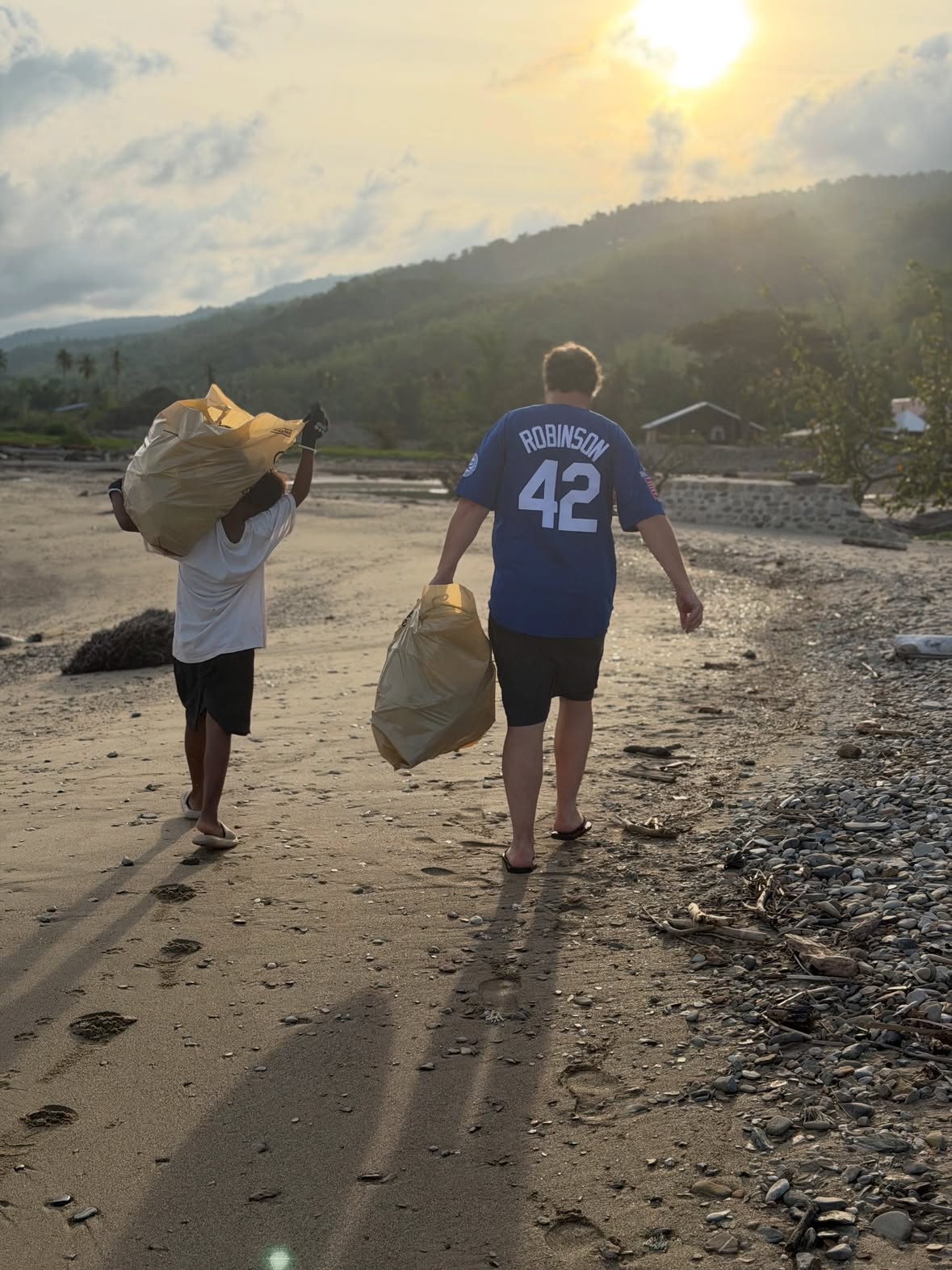 When in Rome or Crete, perhaps Spain even, on beaches, in forests or even in hedgerows near your home, leave it better than when you found it. So my global clean up is well and truly up and running. Yesterday myself, Belle and a superstar 12 year old called Iyan cleaned the beach. This kid! Just wow. He turned up alone after 3 others failed to show, he was literally waiting by the drive as I arrived home. He was briefed in Tagalog and he went at it with utter enthusiasm. He even carried a bag off the beach and I tell you it was heavy! He then wanted to do more, so he filled three bags alone. I have never been more proud of a stranger before. He said he wanted to work hard to help his parents. 😢. This kid has nothing. No PlayStation, bike or even decent trainers. But when he got his wages his eyes lit up! As he left we let him choose some clothes from Charlie’s sports kits, he was so grateful. Grandma gave him a huge bag of freshly picked mangoes to share with his family. I will also leave a fund here so he can continue each week when I return home. He did not just clean a beach, this gave him a sense of agency, pride and a tangible reward for his hard work. The clothes, the mangoes and that regular little wage. That is life changing, sustainable impact. We are giving him a stepping stone, not just a handout. He is coming back tomorrow to earn some more. Until you come here, you do not realise how lucky we truly are. I am hoping Iyan will enjoy having a little job with a regular wage and maybe it develops a work ethic to see him through into adulthood, not only a clean beach but a little kid who has now got a purpose. So remember wherever you go this summer. Take a bag and clean up. X